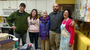 My brothers, sister, grandma, and I are standing in the kitchen where we've eaten so many meals together. 